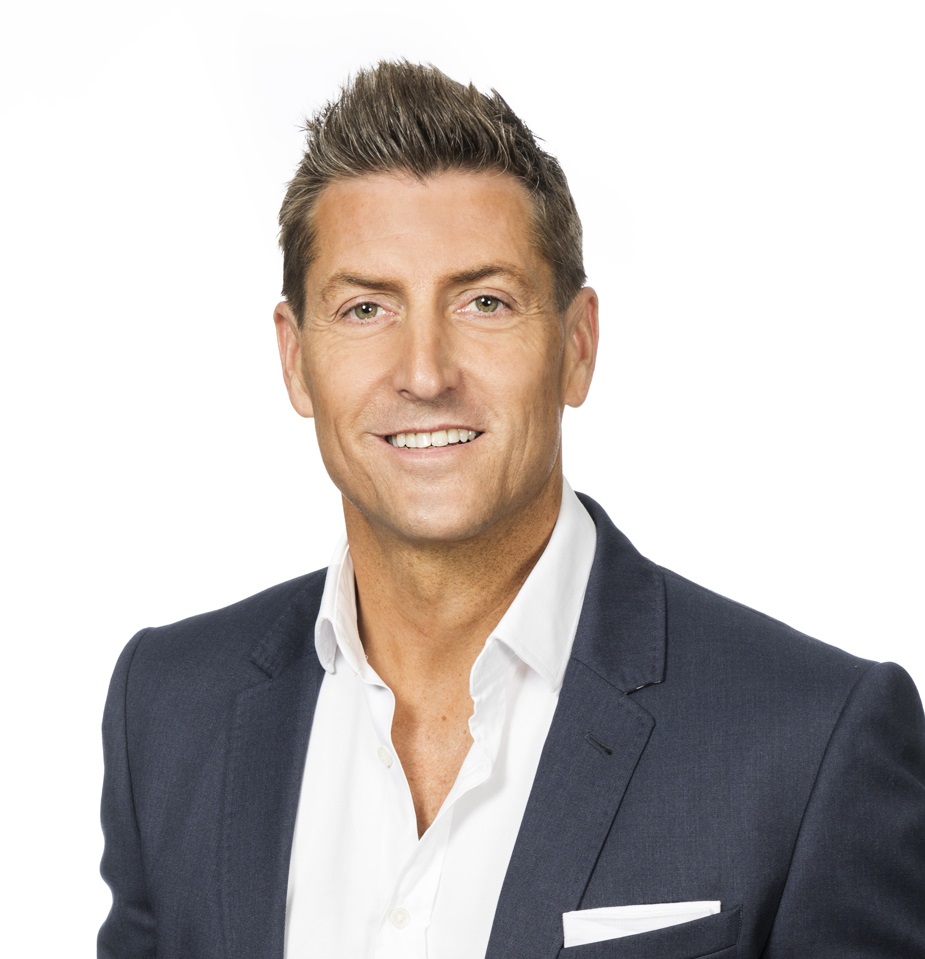 Professional man in a suit smiling, possibly for Elementor Single Post.